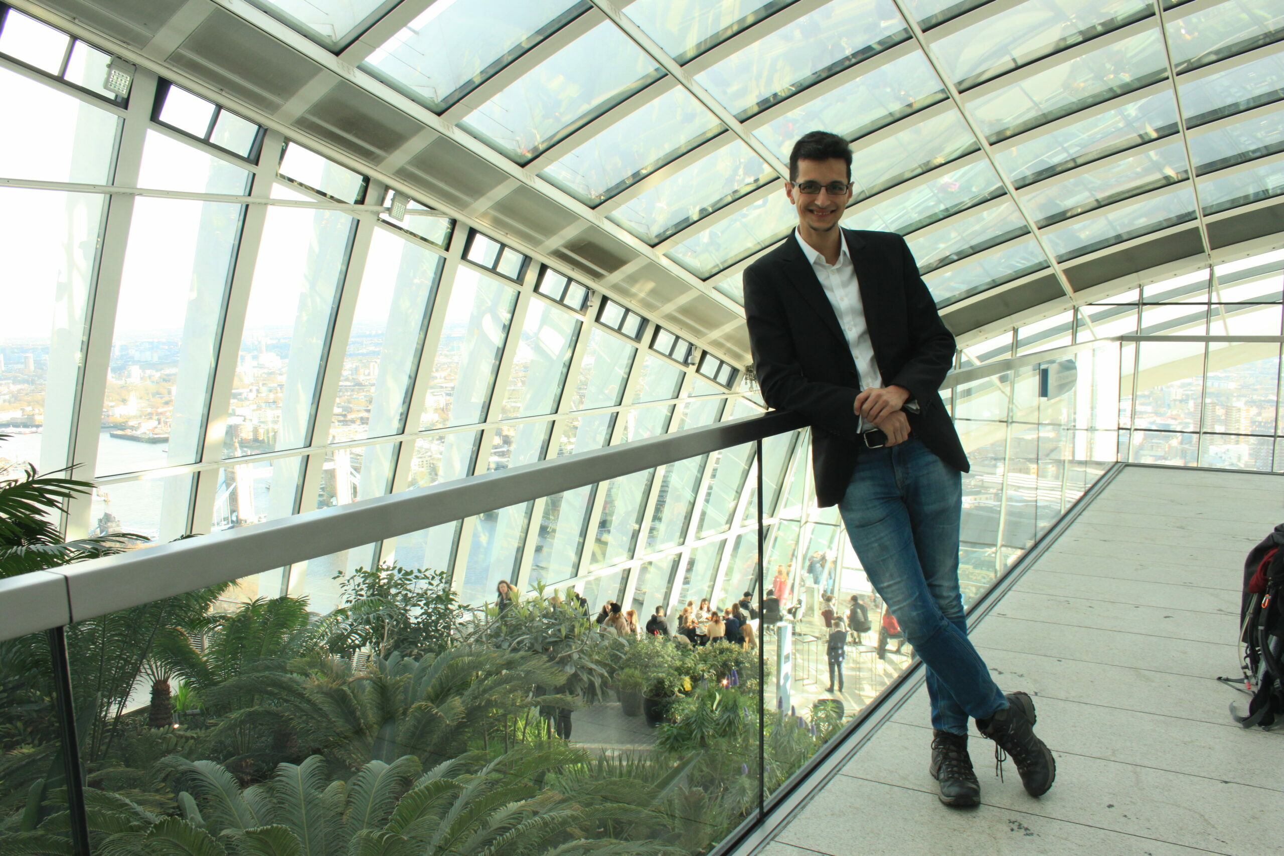Jonas Fathy standing on a platform overlooking Sky Garden in London
